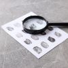 Magnifying Glass With Fingerprints On A Light Background - Auster Inteligência Contábil