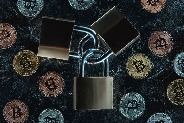 Top View Of Arranged Locks And Various Bitcoins On Dark Marble Surface - Auster Inteligência Contábil